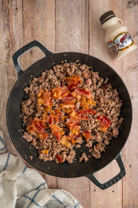 Bacon and sausage in a pan.