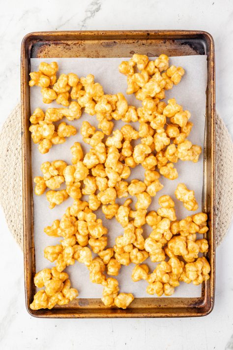 Unbaked Beaver Nuggets on a lined baking sheet.