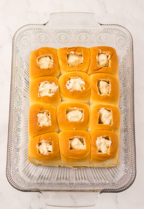 Cream cheese in the wells of Hawaiian Rolls.
