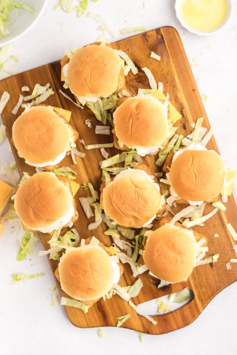 Fish Filet Sliders on a wooden board.