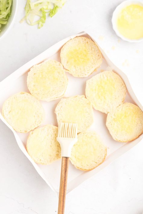 Butter coated slider bun rolls.