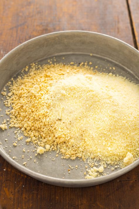 A shallow bowl with breadcrumb mixture.