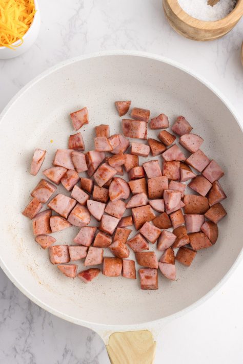 Kielbasa cooking in a pot.