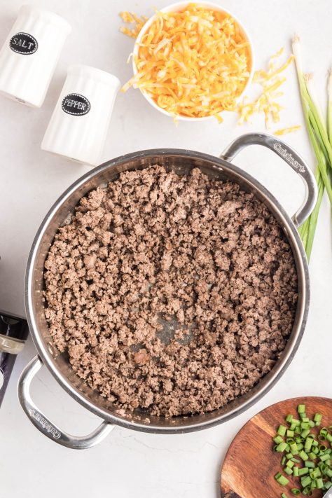 Ground beef in a skillet.