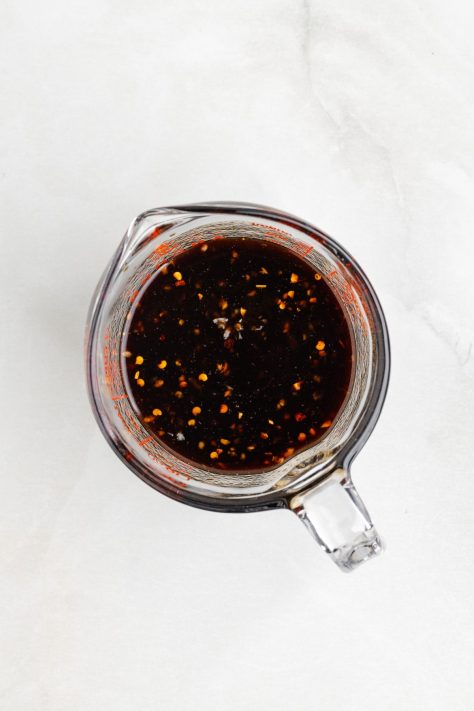 A sauce mixture in a measuring cup bowl.