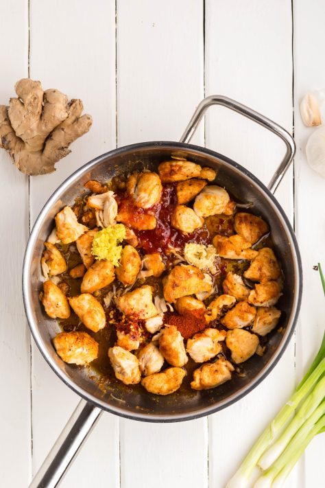 All the ingredients for Sweet Chili Chicken in a skillet.