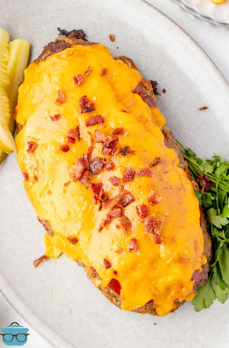 Looking down on a bacon and cheese covered Bacon Cheeseburger Meatloaf.