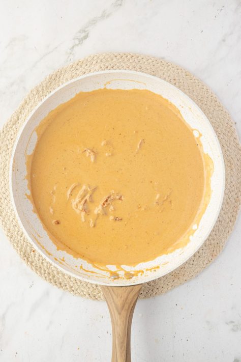 Cajun Alfredo sauce in a saucepan.