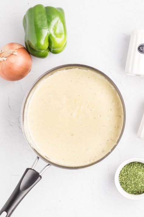 A skillet of cheese sauce.