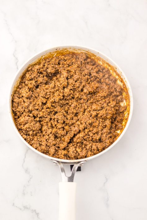 Simmering taco meat in a skillet.