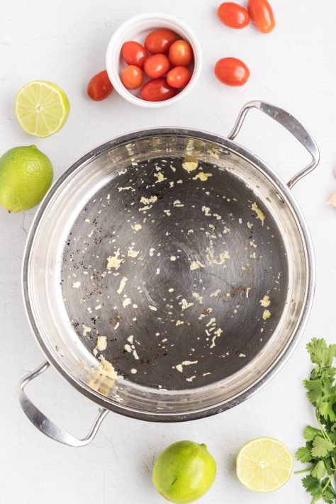 Garlic in a skillet cooking.