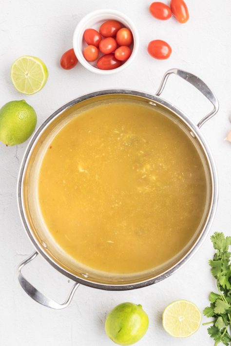 Garlic and enchilada sauce in a skillet.