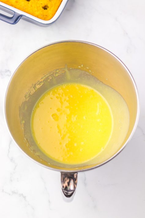 A bowl with sweetened condensed milk, vanilla pudding mix and milk.