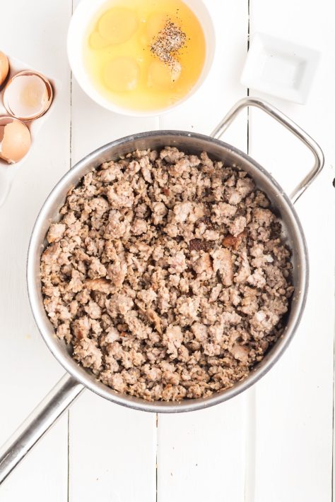 Cooked sausage in a skillet.
