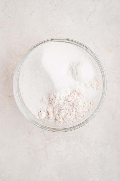 A bowl of flour, sugar, baking powder and salt.