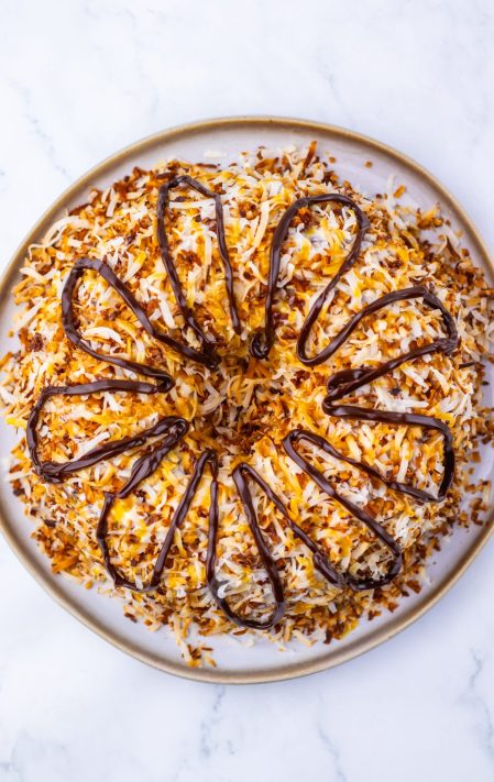 Hot fudge being added to a cake.