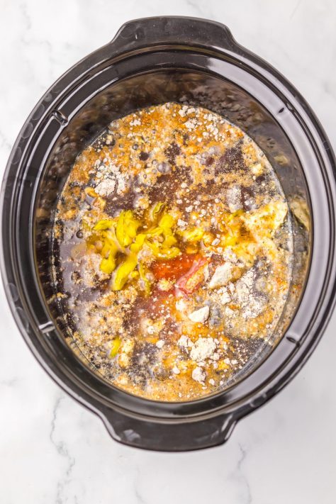 Looking down on ingredients in a Slow Cooker.