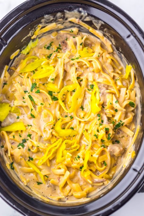 Looking down on a Slow Cooker full of Mississippi Beef and Noodles.