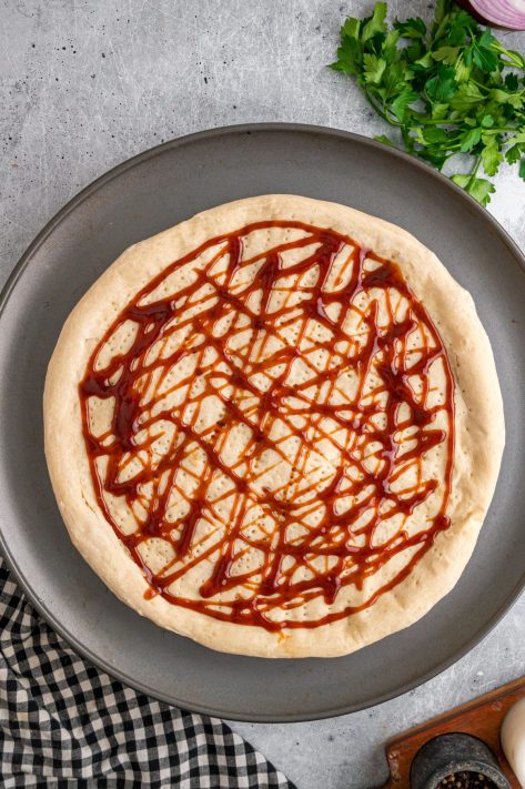 BBQ sauce on a pizza crust.