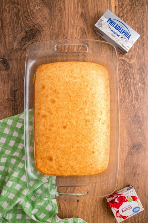 A baked white cake in a baking dish.