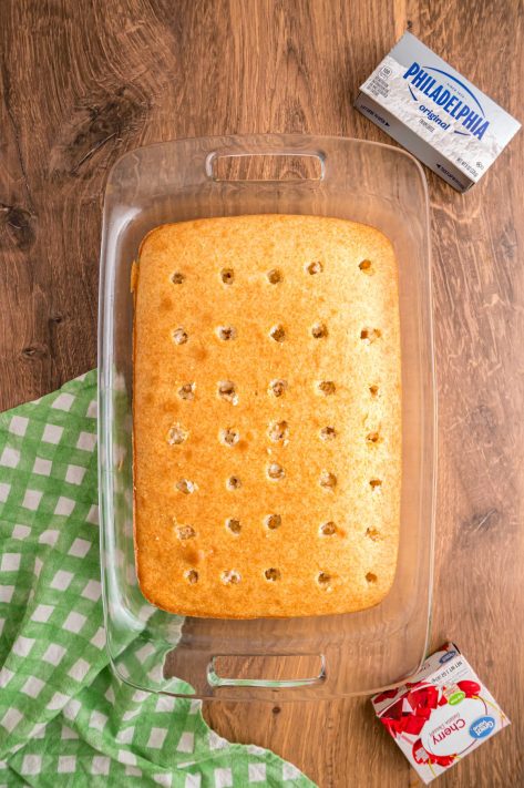 A baked cake with holes in it.