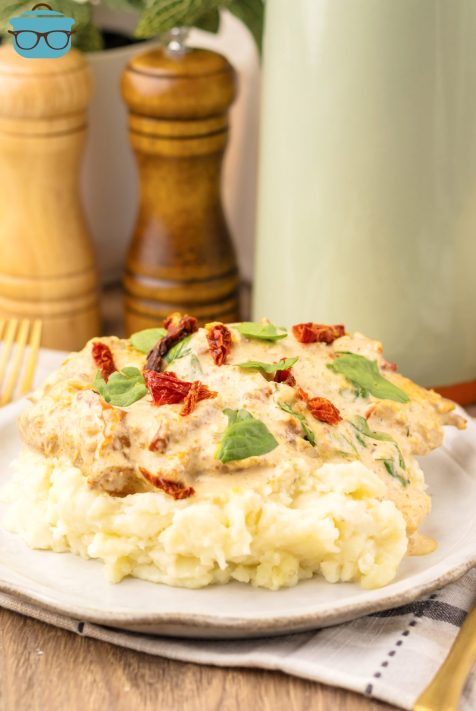 A dinner plate with some Tuscan Chicken.