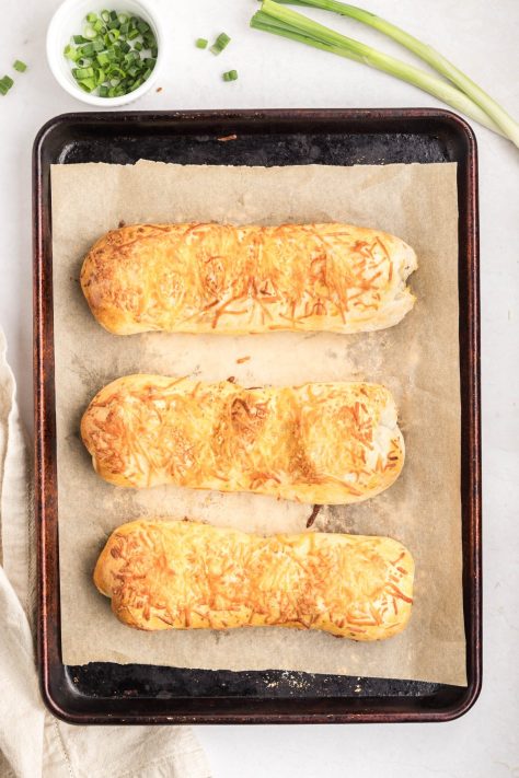 Baked Chicken Bakes on a lined baking sheet.