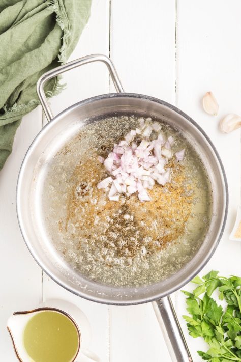Melted butter and shallots in a skillet.