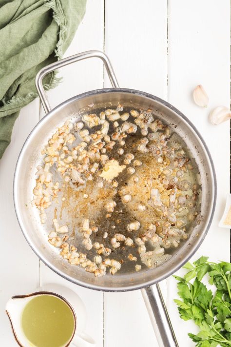 Melted butter, shallot, and garlic in a skillet.