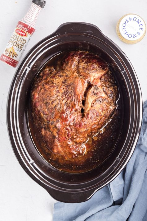 A cooked ham in a Slow Cooker.