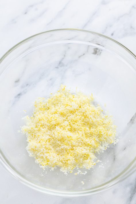 A bowl with sugar and lemon zest.