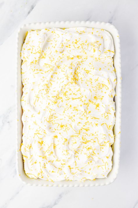 A frosted lemon poke cake.