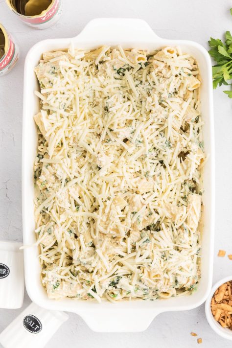 Shredded cheese added to a creamy casserole.