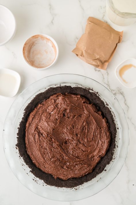 Brownie batter layer on top of Oreo crumb layer.