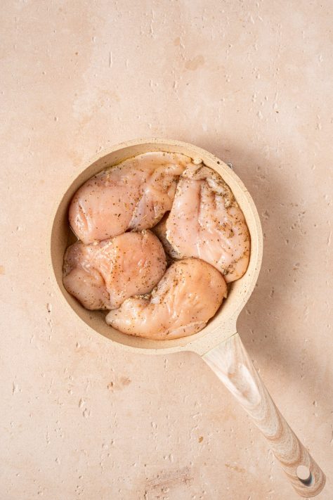 Chicken cooking in a skillet.