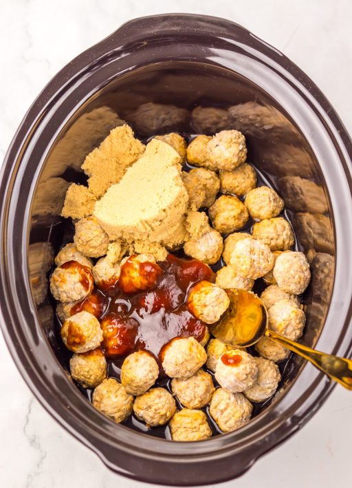 All the ingredients for Slow Cooker Root Beer Meatballs in a Slow Cooker.