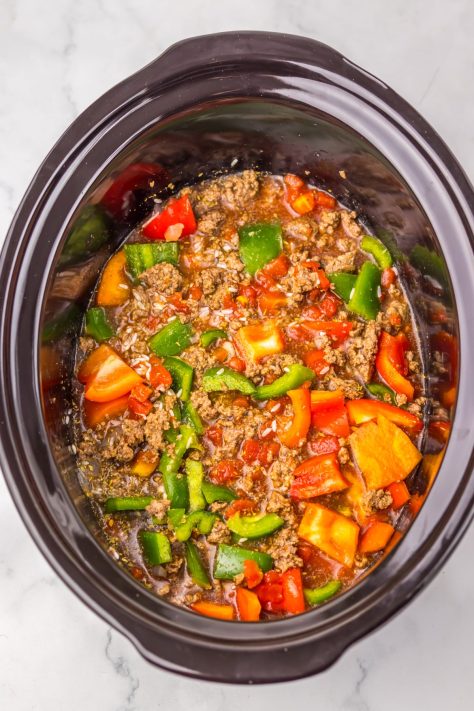 Looking down on a Crock Pot with Stuffed Pepper Casserole.