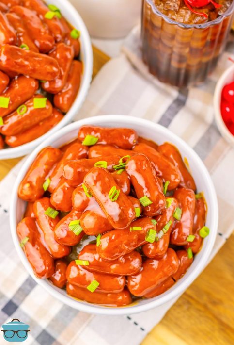 Looking down on a few bowls of Crock Pot Cherry Coke Little Smokies.
