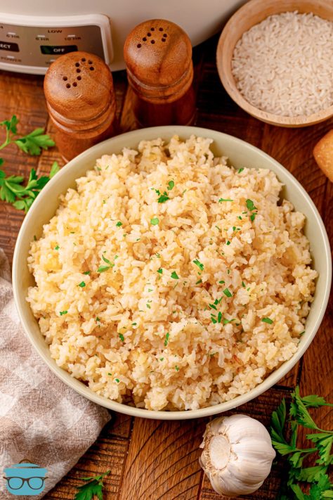 A big white bowl of Garlic Rice Pilaf made in the Crock pot.