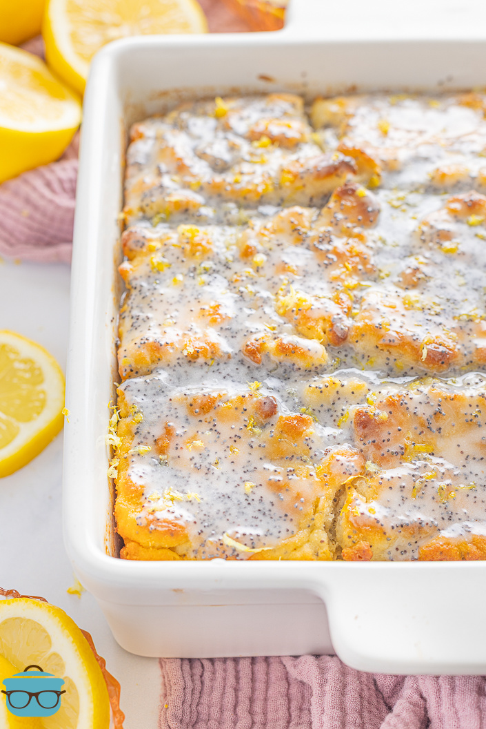 Looking at the end of a baking dish with Lemon Poppy Seed Butter Swim Biscuits.