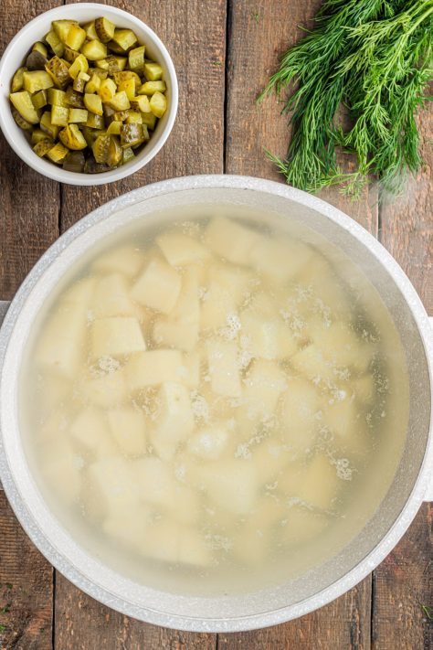 Potatoes boiling in a pot.