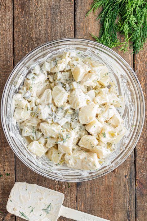 Potato Salad with Dill Pickles in a bowl.