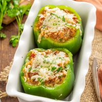 Two Stuffed Peppers in a baking sheet.