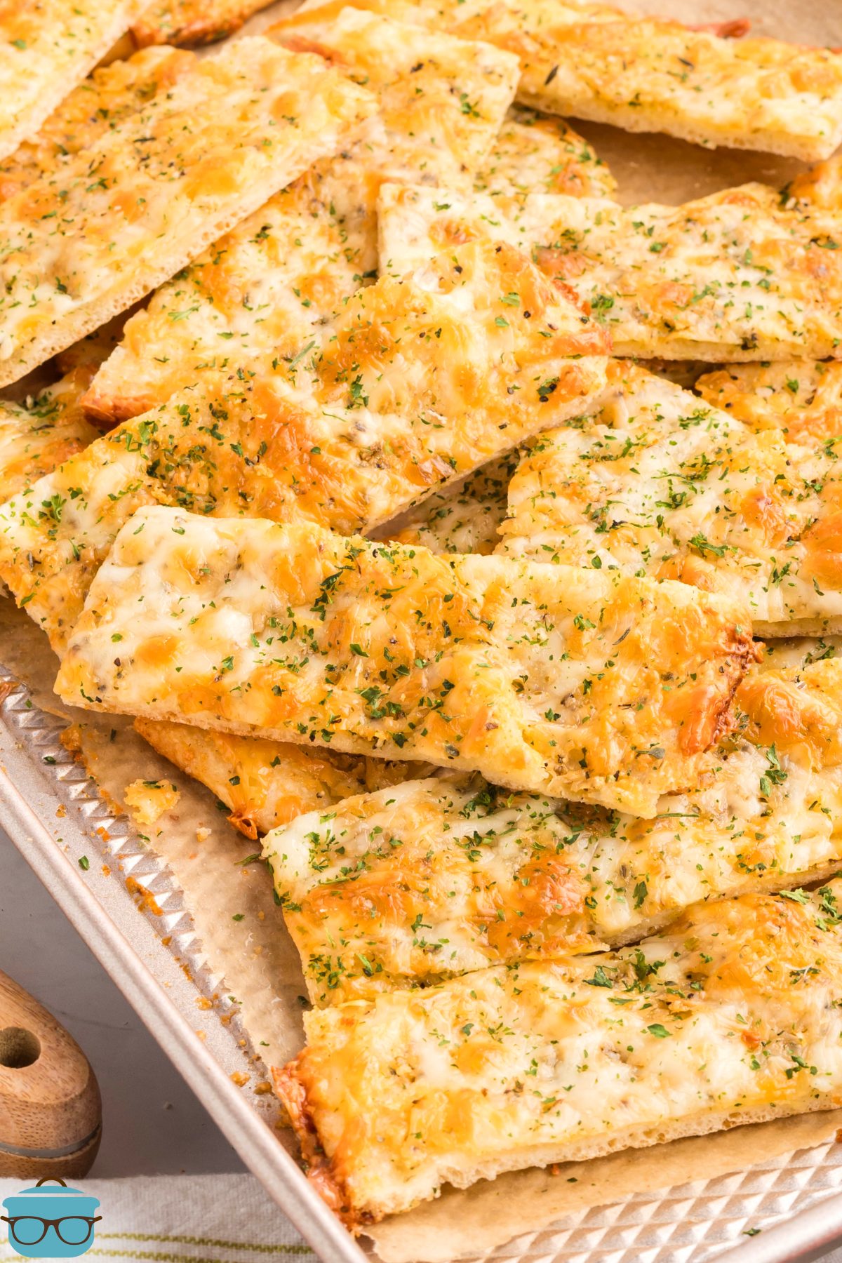 A bunch of pieces of Pizza Dough Garlic Cheese Bread.