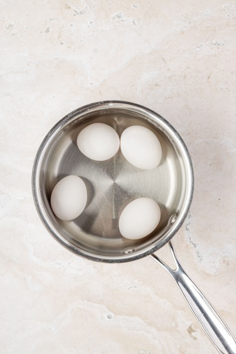 Eggs cooking in a pan.
