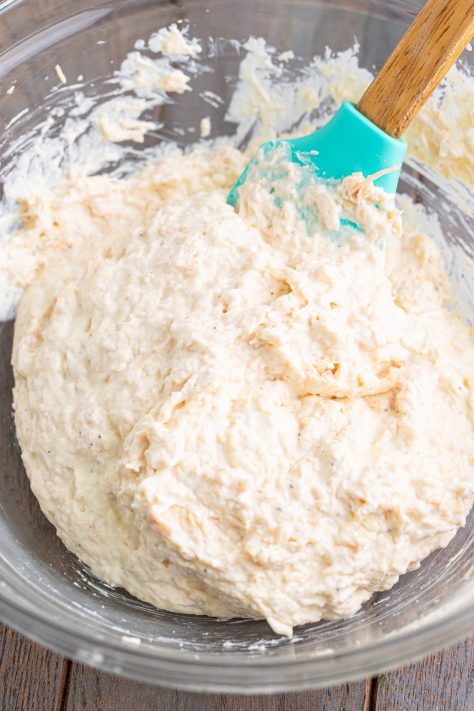 Chicken spread in a bowl being mixed.