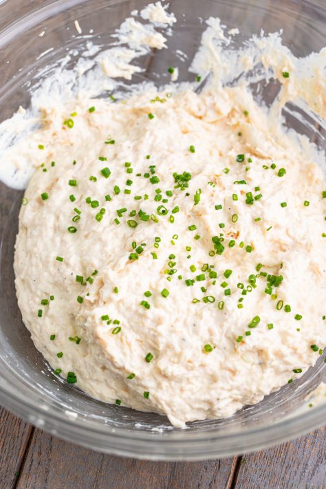 Chicken Spread with sliced chives in a bowl.