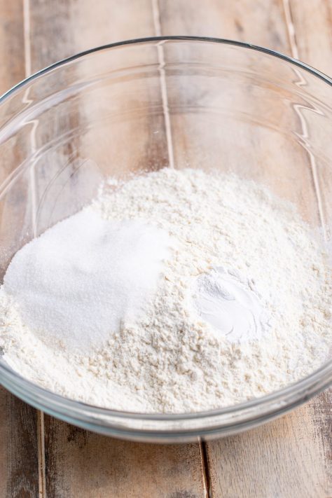 A bowl of flour, sugar, and baking powder.
