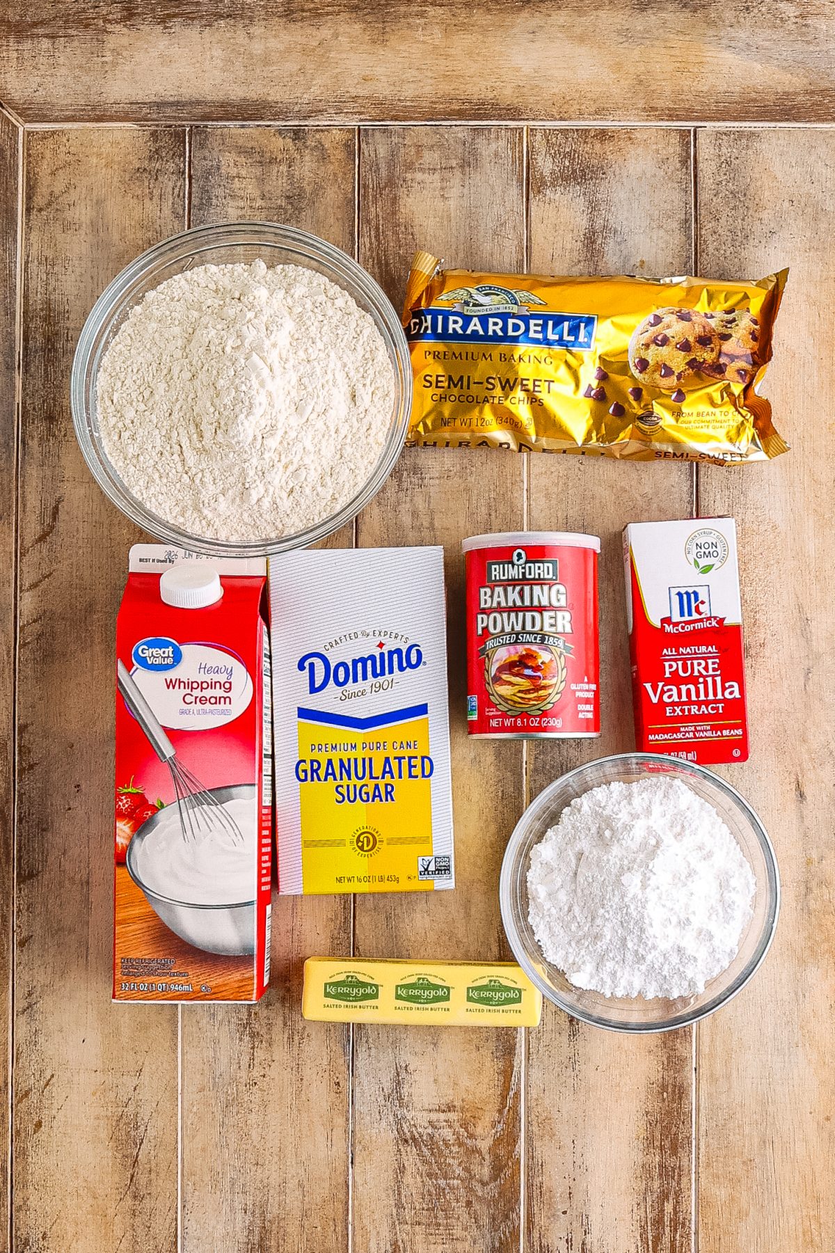 All-purpose flour, granulated sugar, baking powder, heavy cream, vanilla extract, semi-sweet chocolate chips, salted butter, powdered sugar, and milk.