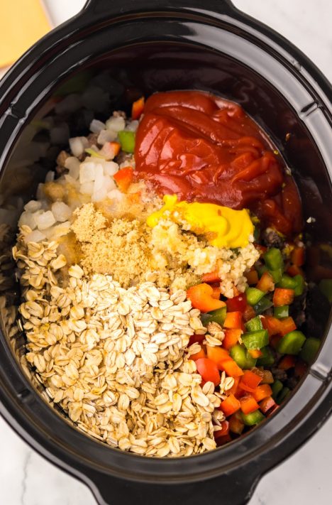 sloppy Joe ingredients added to slow cooker.